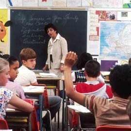 Teacher standing in front of a group of children
