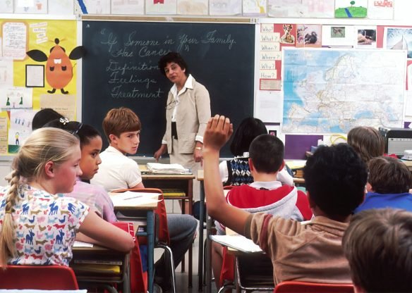 Teacher standing in front of a group of children