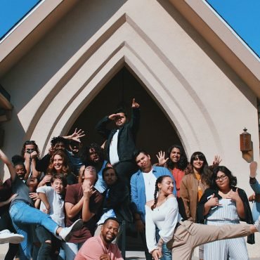 Community gathered outside a house