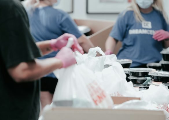 Volunteers packing food donations